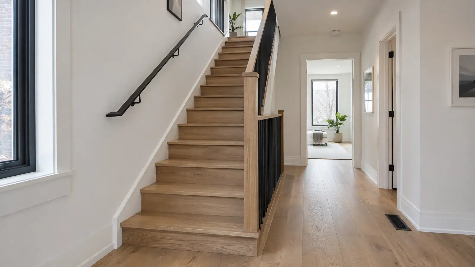 Wood staircase and clear hall in a residential addition concept